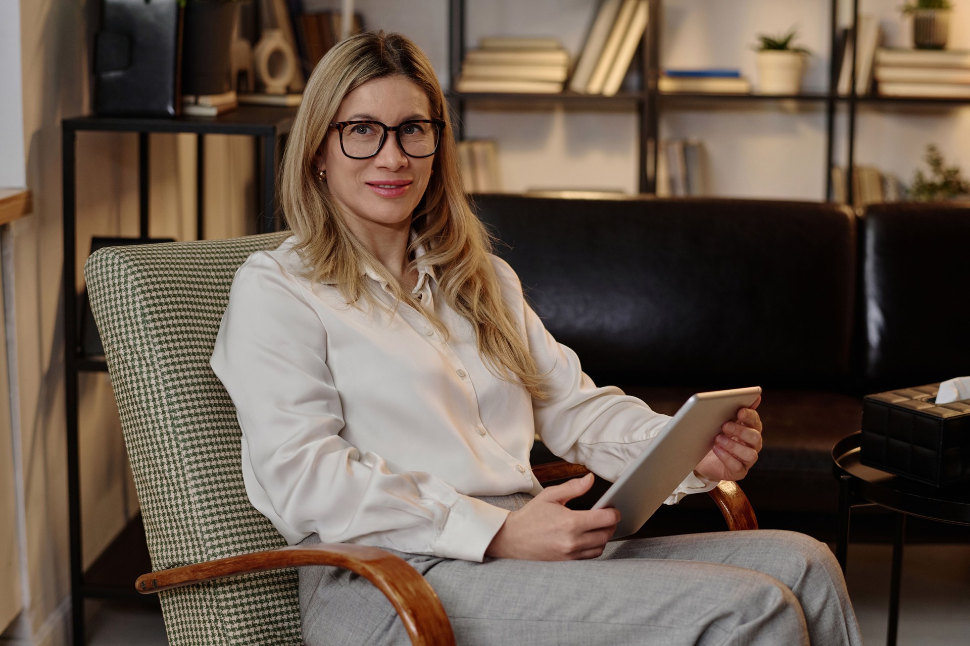 Experienced Psychologist Posing at Her Workplace
